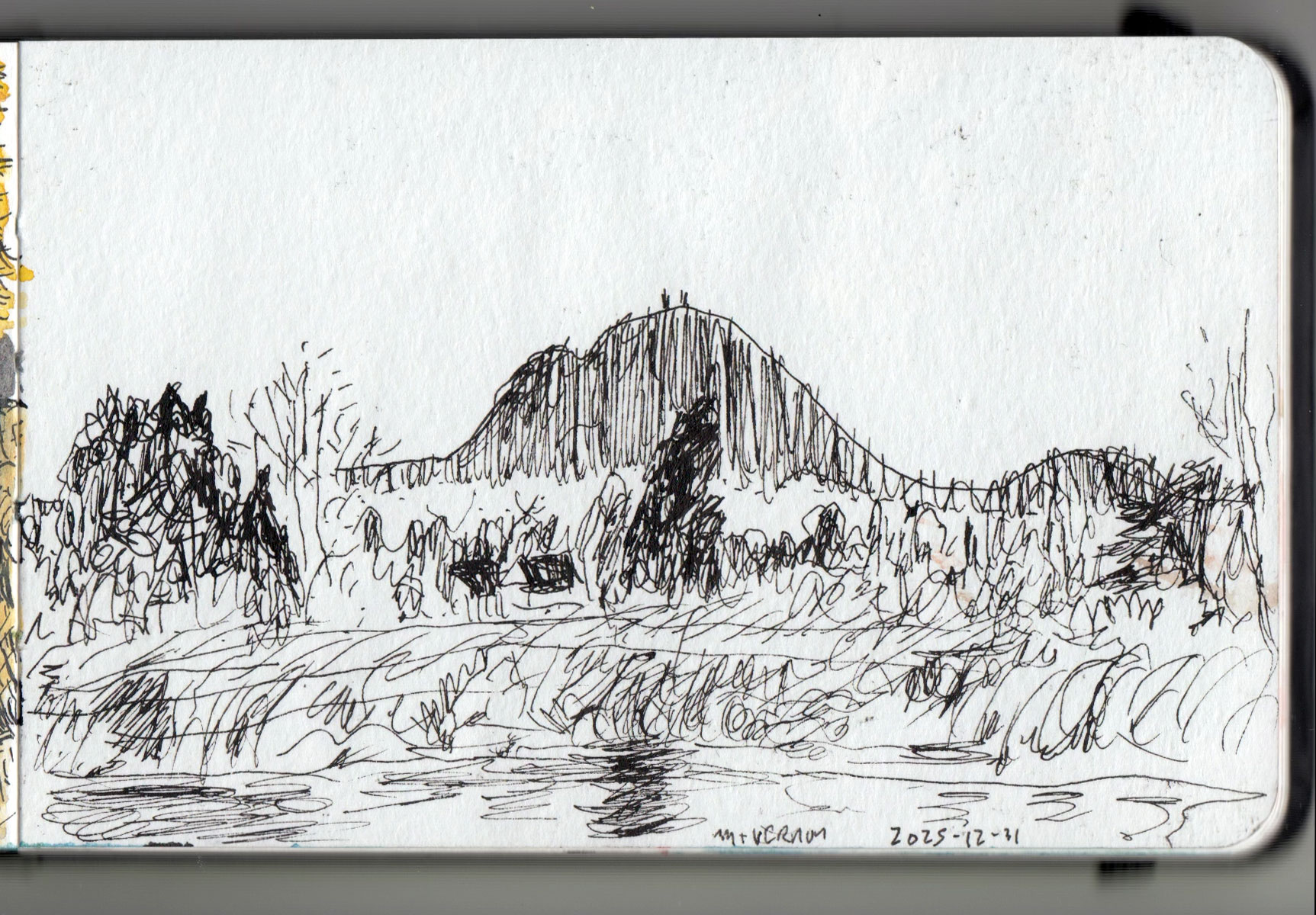 Landscape drawing in a sketchbook.